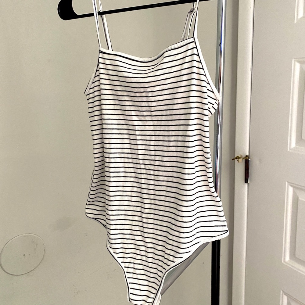 White and black striped body suit